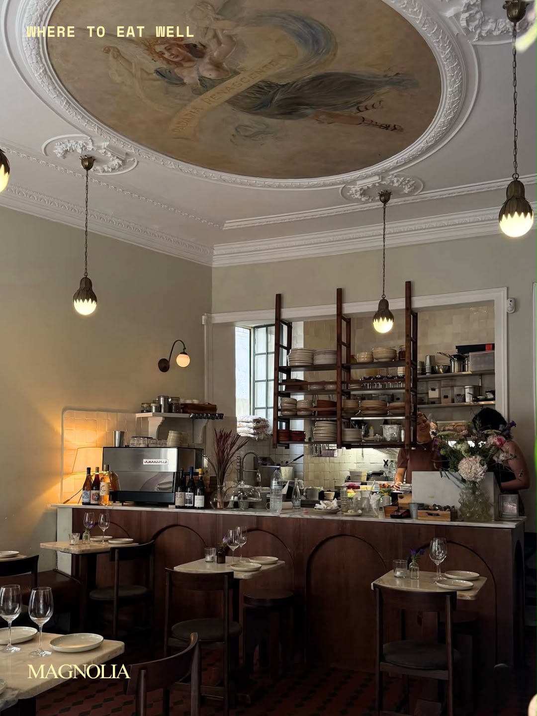 The frescoed dining room and marble counter at Magnolia, Lisbon